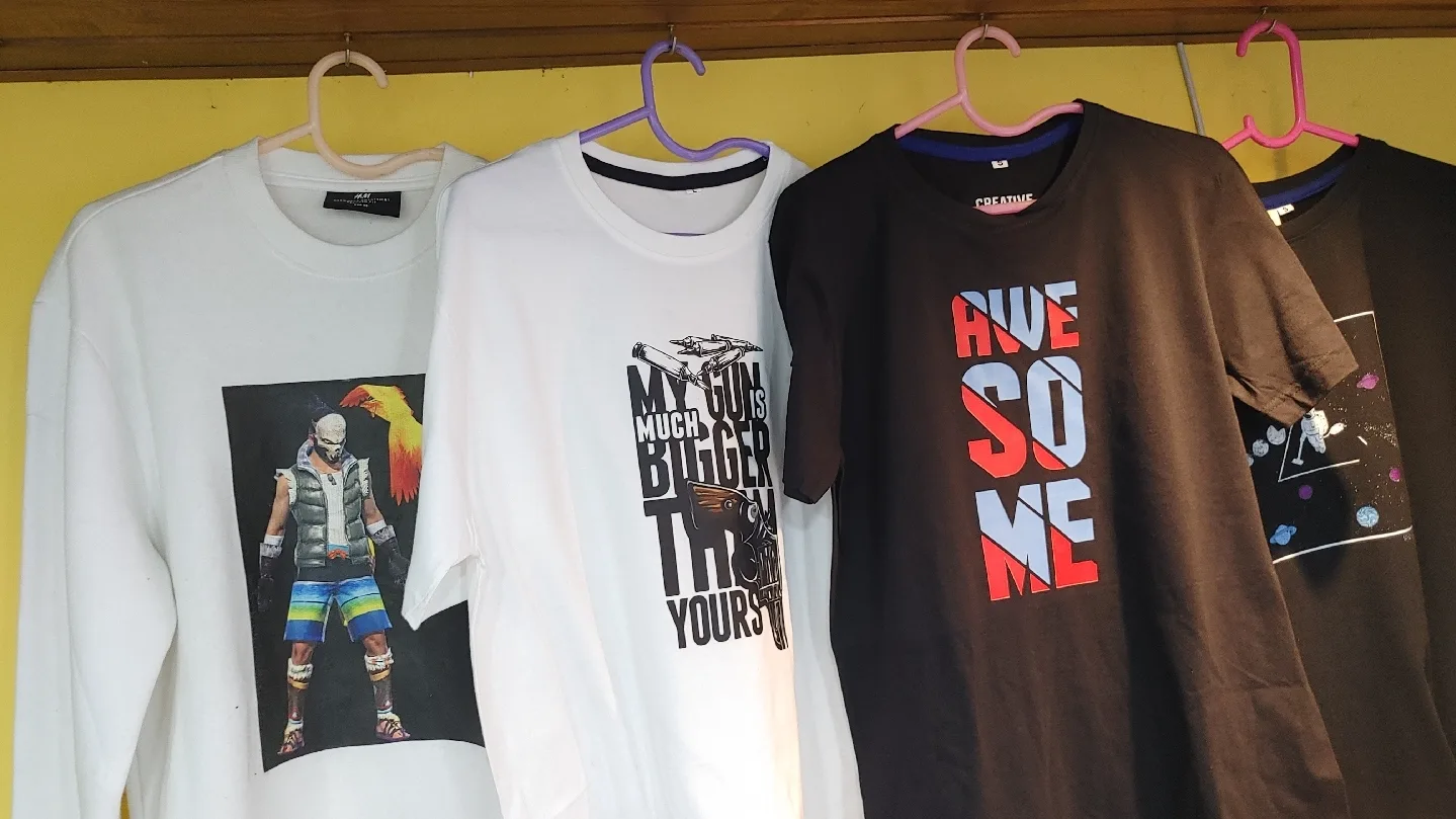 DTF printed t-shirts on hangers — explaining what is DTF printing and how Direct-to-Film works